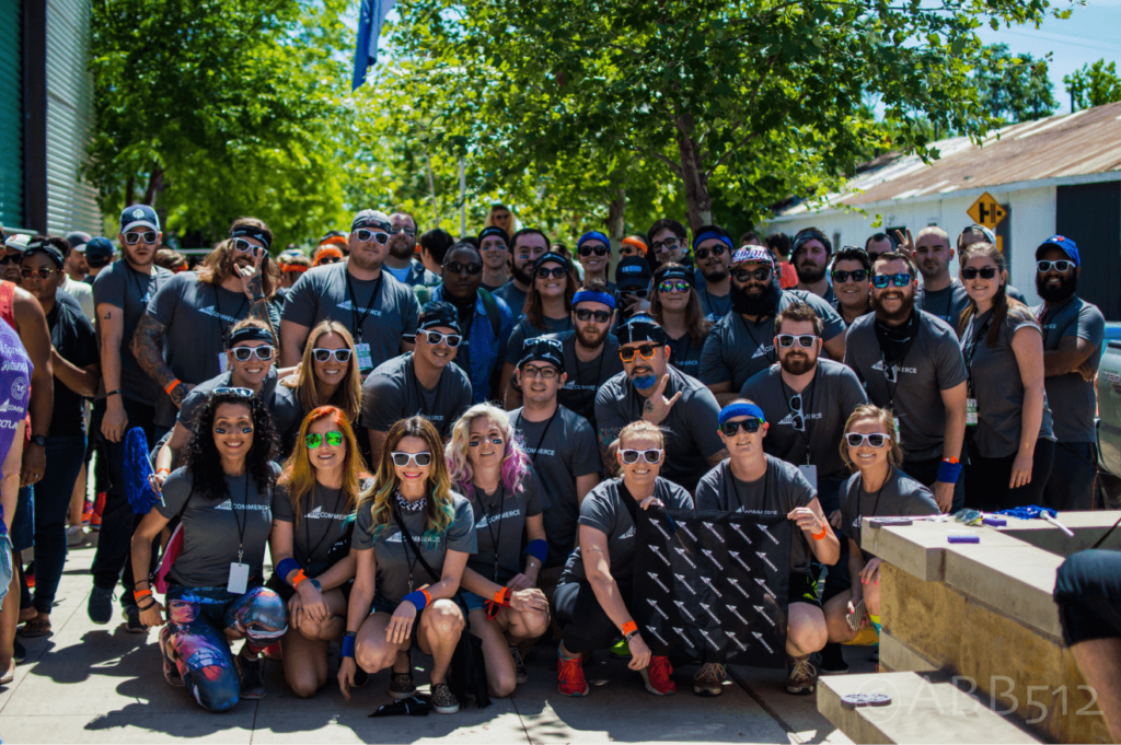 Group photo of the CrowdRiff team outdoors at a company event.