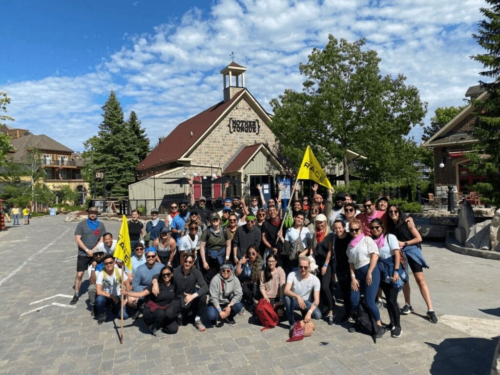 Group photo of the CrowdRiff team outdoors at a company event.